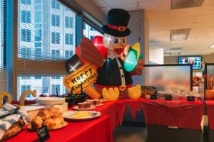 An assortment of savory and sweet dishes, including green beans, mac and cheese, and sweet potato casserole, ready to be enjoyed at the 2022 Westmount Realty Thanksgiving potluck.