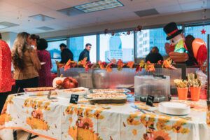 2022 Westmount Realty Thanksgiving potluck in our downtown Dallas office location. What a great view of the skyline.