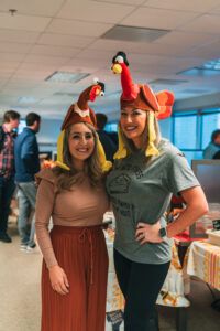 The Westmount Realty HR team wearing turkey hats for the company potluck.