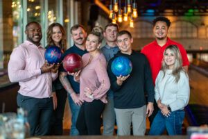 Westmount Realty bowling happy hour team photo at Bowl and Barrell Dallas