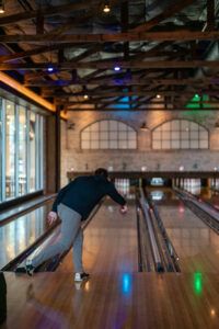 Perfect bowling form at Bowl & Barrell Dallas